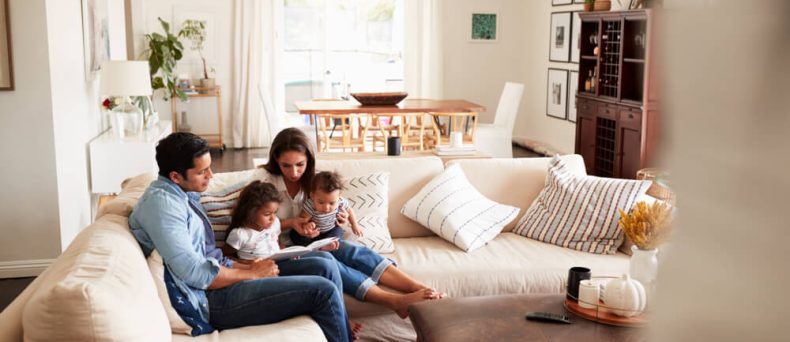 Family relaxing at home while learning about Georgia home insurance deductibles.